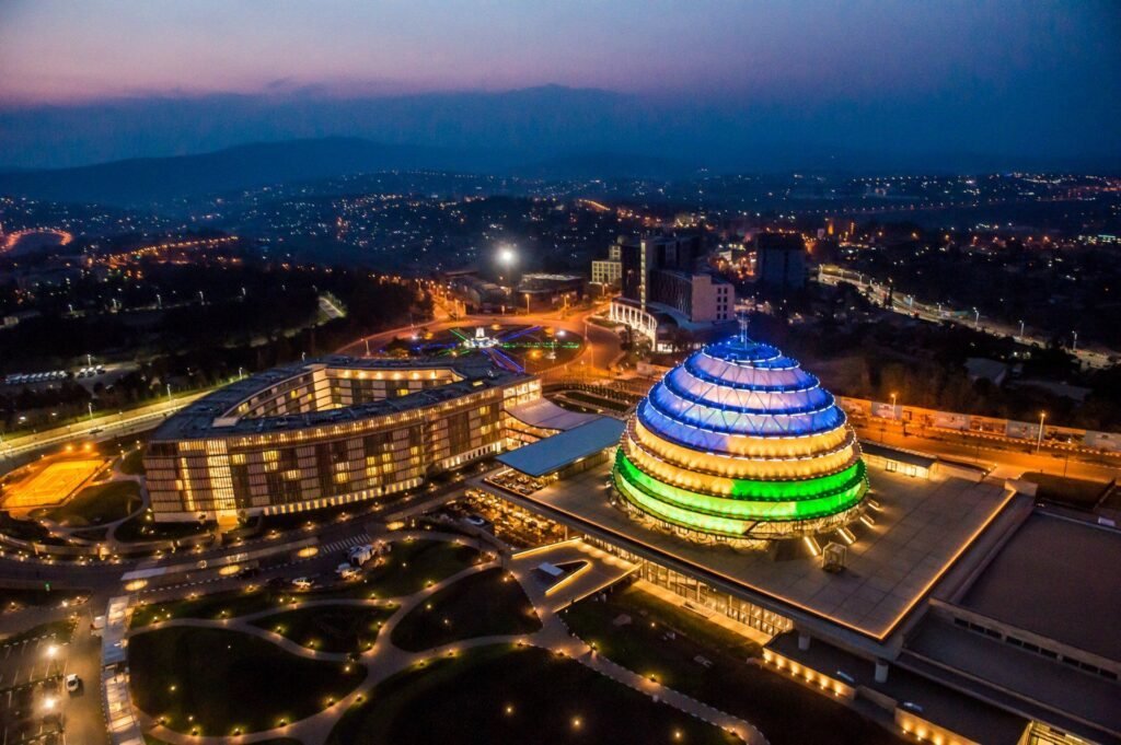 Kigali at night, with the convention centre lit above the city